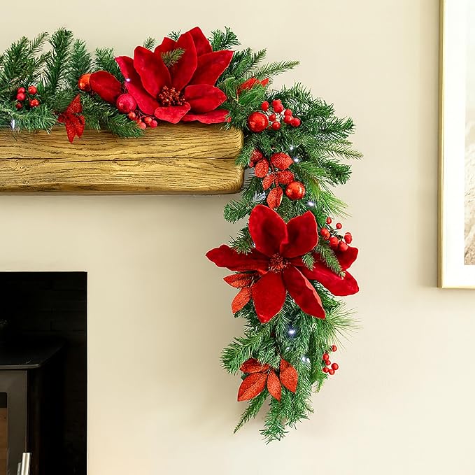 Decorated fireplace with Christmas garland, candles, and a clock on the wall.
