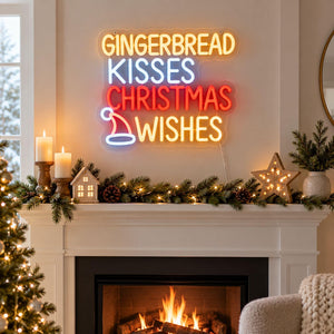 A festive Christmas-themed neon wall sign reading 'GINGERBREAD KISSES CHRISTMAS WISHES' in glowing yellow, blue, and red lettering, mounted above a decorated fireplace mantel with candles, greenery, and a star light.