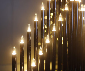 String of lights hanging against a dark background