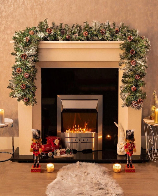 Decorative fireplace with Christmas garland, candles, and nutcrackers in a warm setting.