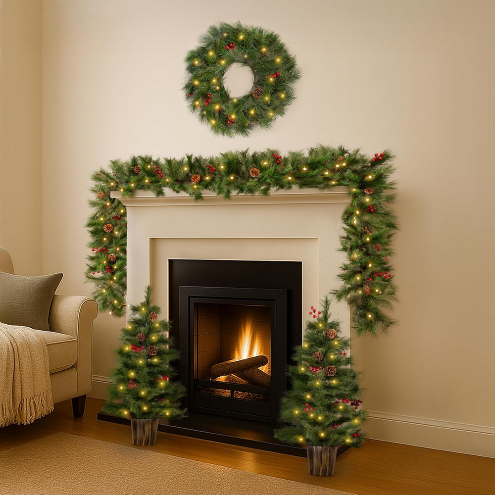 Decorated fireplace with Christmas wreath, garland, and trees in a living room.