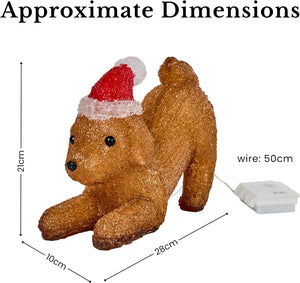 A small brown dog-shaped holiday decoration wearing a red and white Santa hat, shown with overlaid dimension lines and text indicating approximate measurements and a 50 cm wire length on a white background.