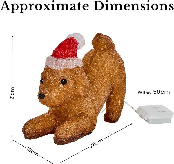 A small brown dog-shaped holiday decoration wearing a red and white Santa hat, shown with overlaid dimension lines and text indicating approximate measurements and a 50 cm wire length on a white background.