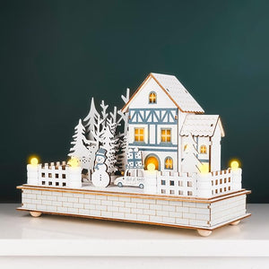 Decorative house model with lights on a dark background