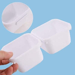 White storage trays holding small household items