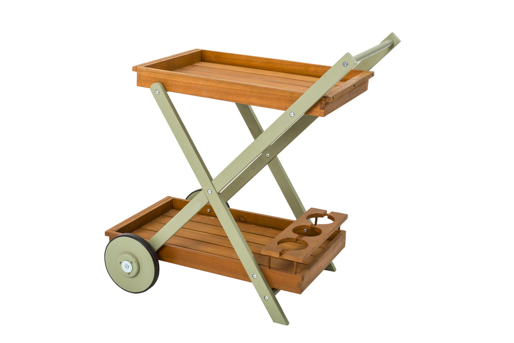 A green wooden drinks trolley with wheels, featuring a tray on top with a white teapot and flowers, set in a garden environment.