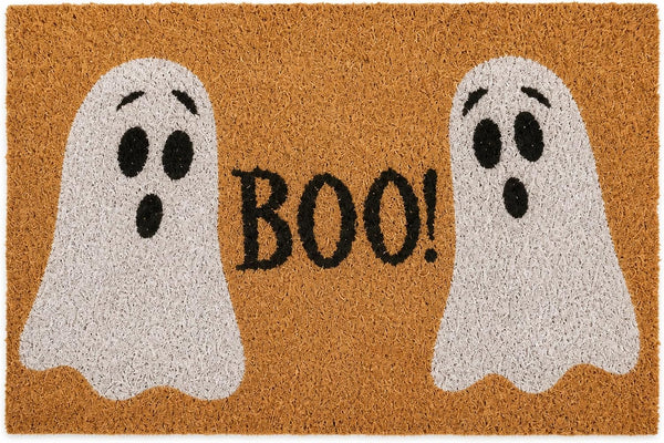 A rectangular tan coir doormat with two white ghost figures and the word "BOO!" in black across the center.