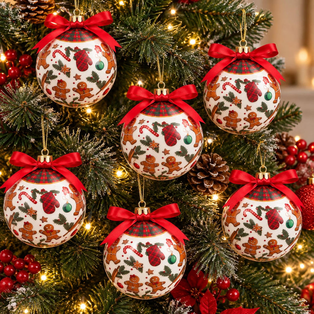 Six Christmas tree ornaments hanging on a decorated Christmas tree. The ornaments are round, white, and decorated with gingerbread men, candy canes, holly, and red stockings, each topped with a red ribbon bow.