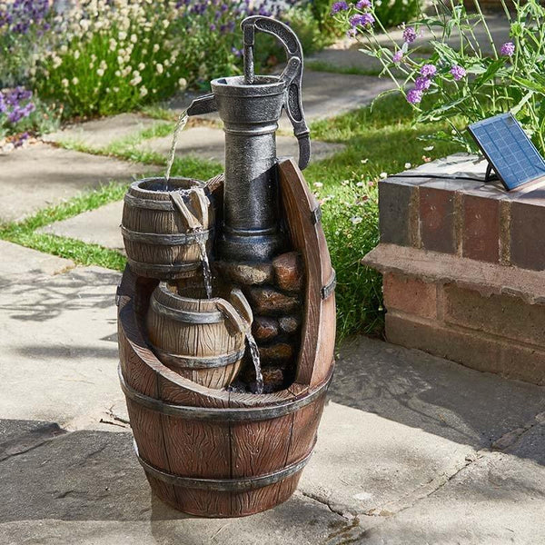 Whiskey Barrel Water Feauture in a summer garden