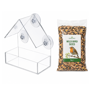 A clear plastic house-shaped bird feeder with suction cups shown next to a 1kg bag of Garden Mile Wild Bird Seed on a white background.