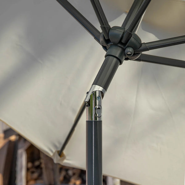 Close-up detail of a patio umbrella showing the dark gray metal pole, joint, and canopy fabric.
