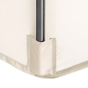 Close-up of a cream-colored fabric corner with a black metal support pole inserted into a reinforced fabric sleeve.