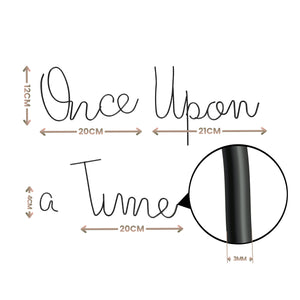 A black cursive wall decal reading 'Once Upon a Time' with dimension annotations showing the size of the letters, the full word length, and a magnified section of the black script.