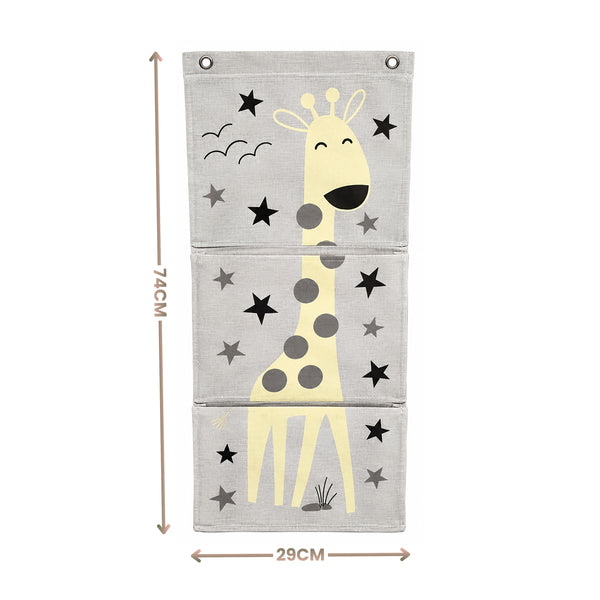 A three-panel fabric wall hanging with a cartoon giraffe and star pattern, shown with dimension arrows and labels indicating 74CM height and 29CM width on a white background.