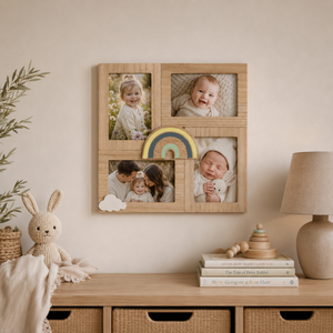 A light natural wood four-frame photo collage wall organizer displayed on a beige wall above a wooden dresser in a styled nursery setting. The frames display photos of children, and the wooden piece is decorated with a small rainbow charm, a white cloud accent, and a small wooden bunny toy.
