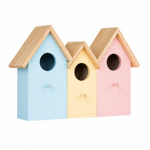 Three small wooden birdhouses in pastel blue, yellow, and pink, arranged side by side against a plain white background.