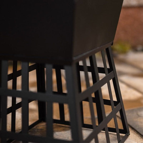 Black metal fire pit for rustic garden décor