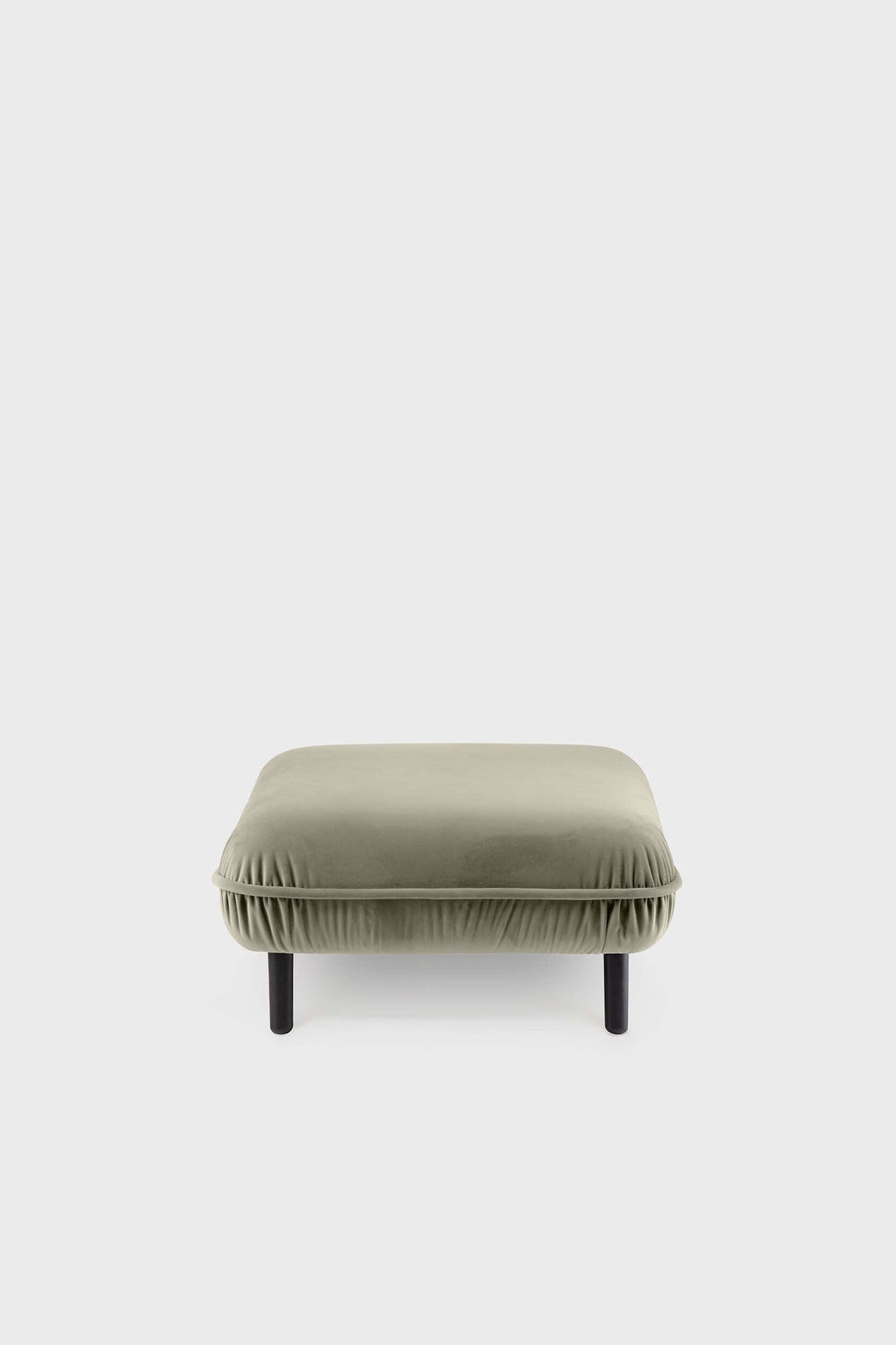 A green Bean Pouf with elegant wooden legs and a soft velour fabric cover.