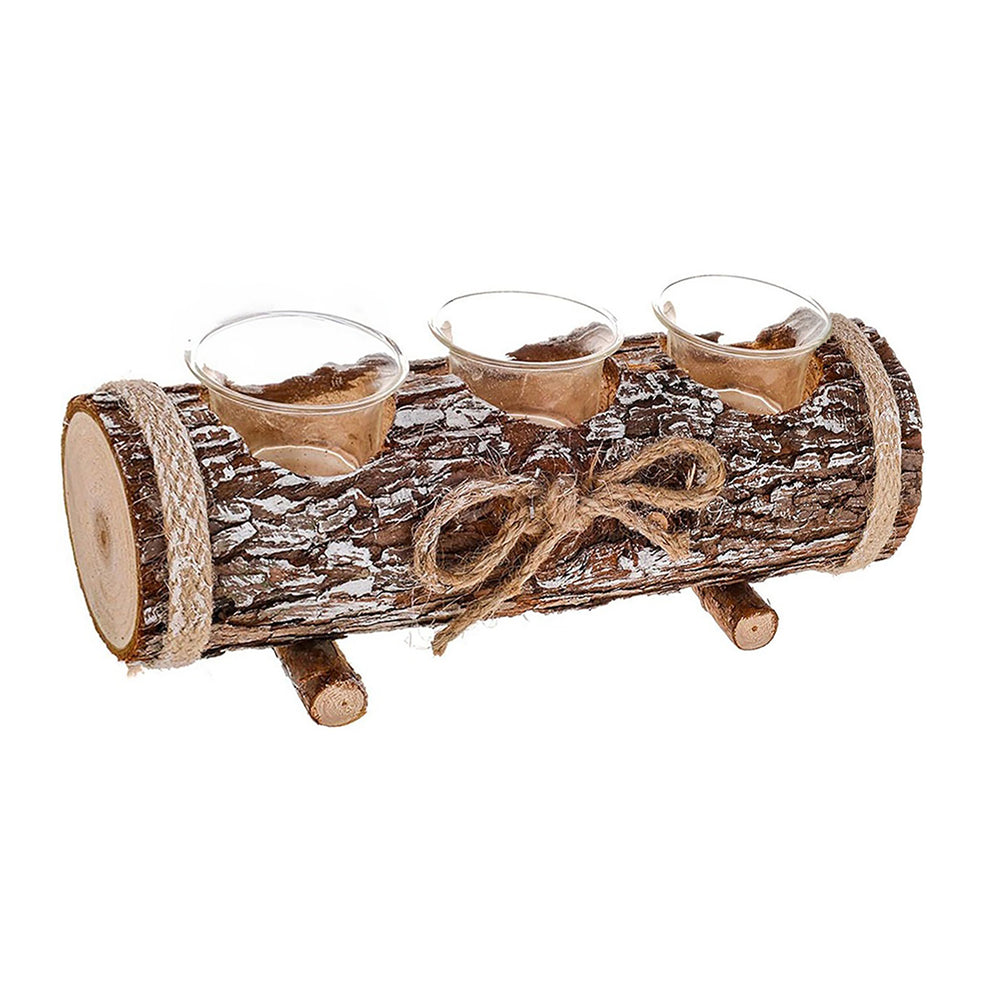 A rustic three-candle holder made from a log slice with twine and small wooden feet, holding three lit tealight candles on a dining table runner.