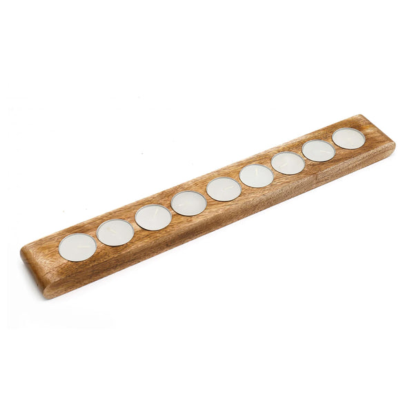 A wooden mezuzah case with seven circular silver metal inserts, shown on a plain white background.