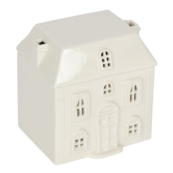 White ceramic house-shaped object on a white background