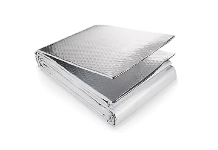 Folded metallic blanket on a white background