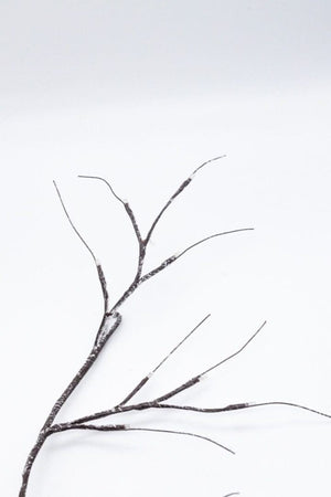 Illuminated twig garland used as Christmas home decor