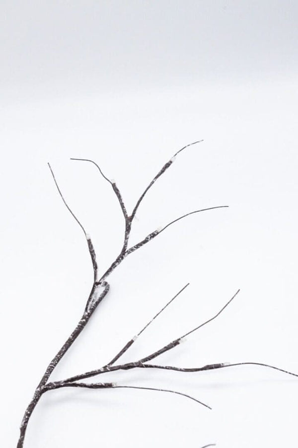 Illuminated twig garland used as Christmas home decor