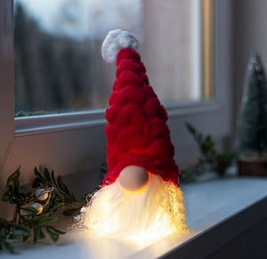 Light up Christmas gonk displayed on mantelpiece