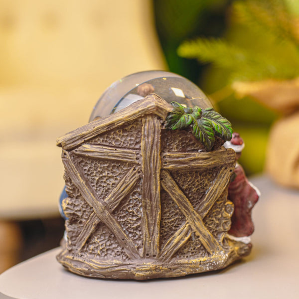 Mary Joseph and Jesus inside Christmas snow globe