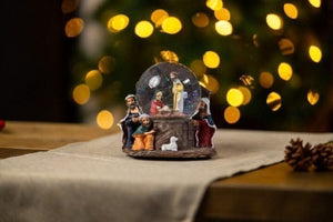 Festive snow globe with baby Jesus scene