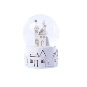 Illuminated Christmas snow globe shown from front