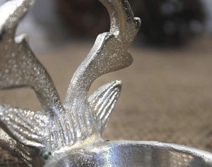 Festive stag candle centrepiece shown on table