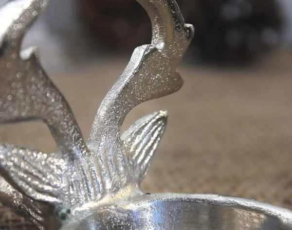 Festive stag candle centrepiece shown on table