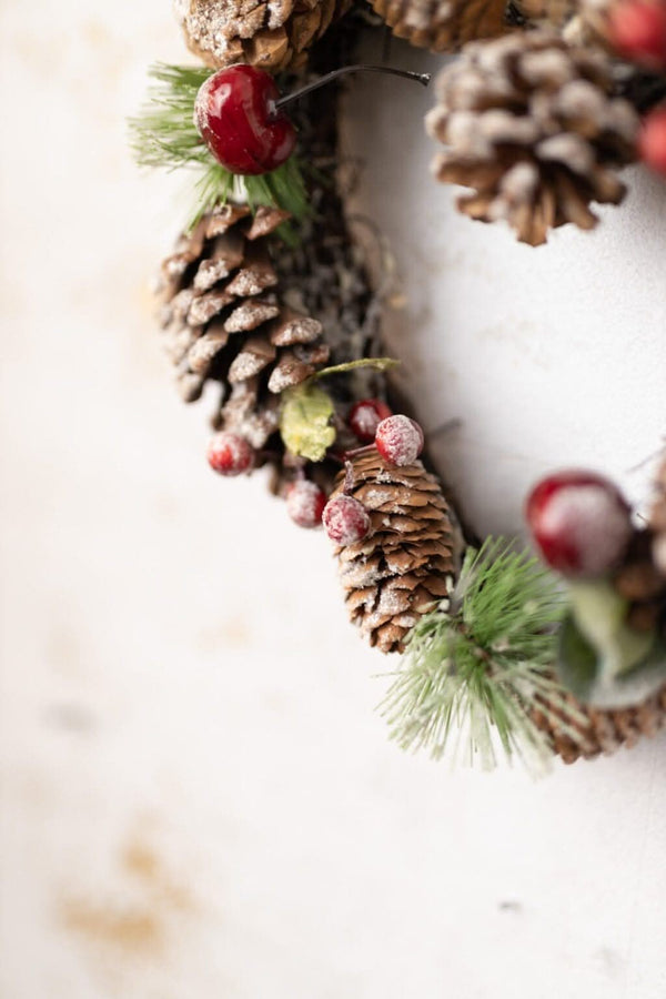 Rustic festive greenery arranged in a heart shape