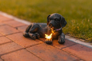 Decorative dog statue for patio and garden lighting