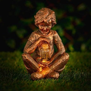 Decorative solar garden figure with warm ambient lighting