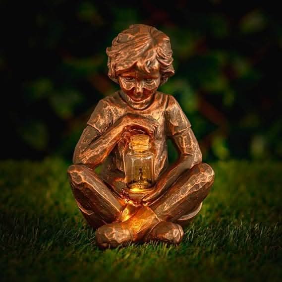 Decorative solar garden figure with warm ambient lighting