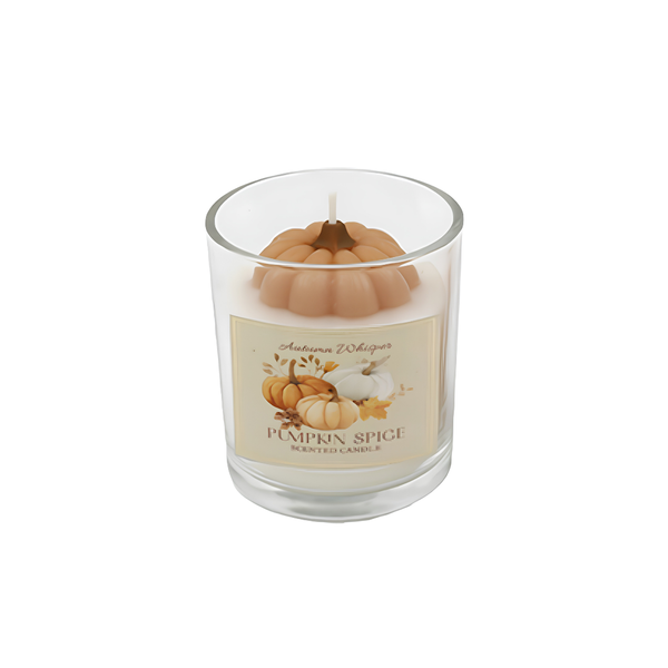 A 'Pumpkin Spice' scented soy wax candle in a clear glass jar, featuring a decorative tan pumpkin-shaped wax insert and a cream-colored label with illustrations of pumpkins.