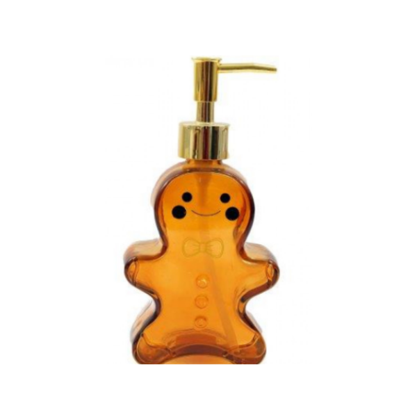 An amber-colored gingerbread man shaped pump bottle with a gold pump dispenser, shown against a plain white background.