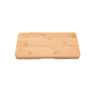 A rectangular bamboo cutting board with rounded corners and a small recessed handle slot on the front edge, shown on a plain white background.