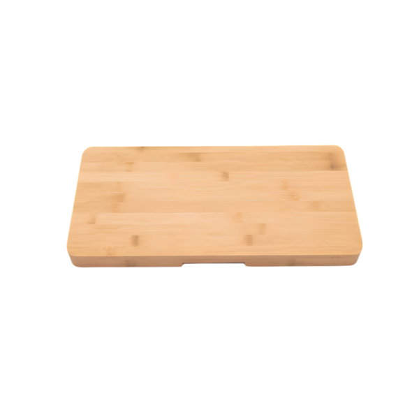 A rectangular bamboo cutting board with rounded corners and a small recessed handle slot on the front edge, shown on a plain white background.