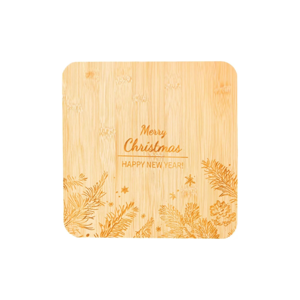 A square bamboo coasters with rounded corners, featuring laser-engraved pine branches, pinecones, and the text 'Merry Christmas Happy New Year!' on a plain white background.