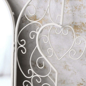French country mirror displayed in a hallway