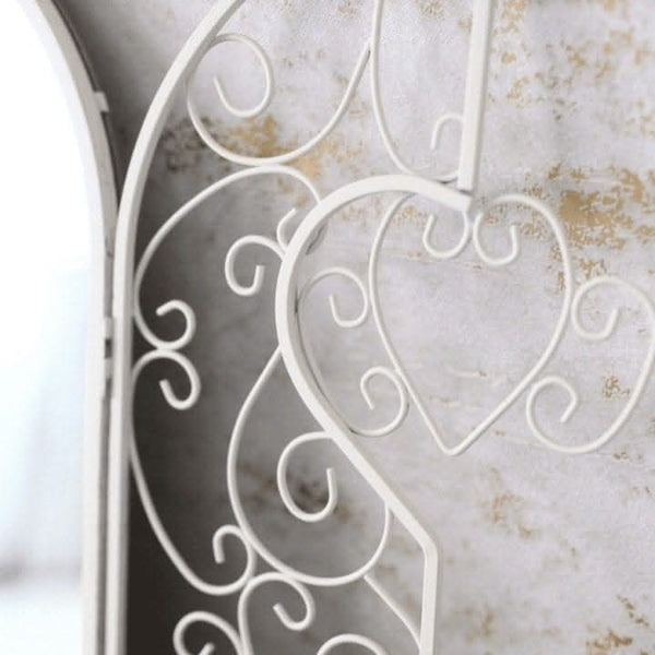 French country mirror displayed in a hallway