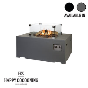 Outdoor fire table with glass cover and visible flames, featuring 'Happy Cocooning' brand.