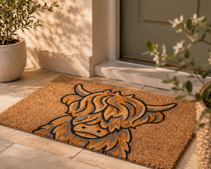 Highland cow coir door mat at front entrance