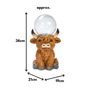 Solar Highland cow with illuminated crackle glass ball