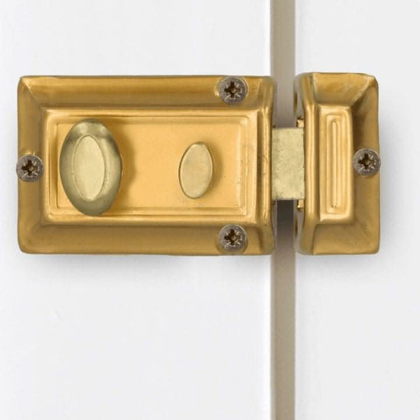 Home security rim lock with polished brass trim