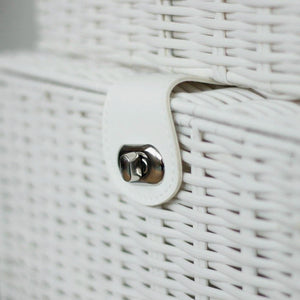 Close-up of a white woven basket with a metal latch.